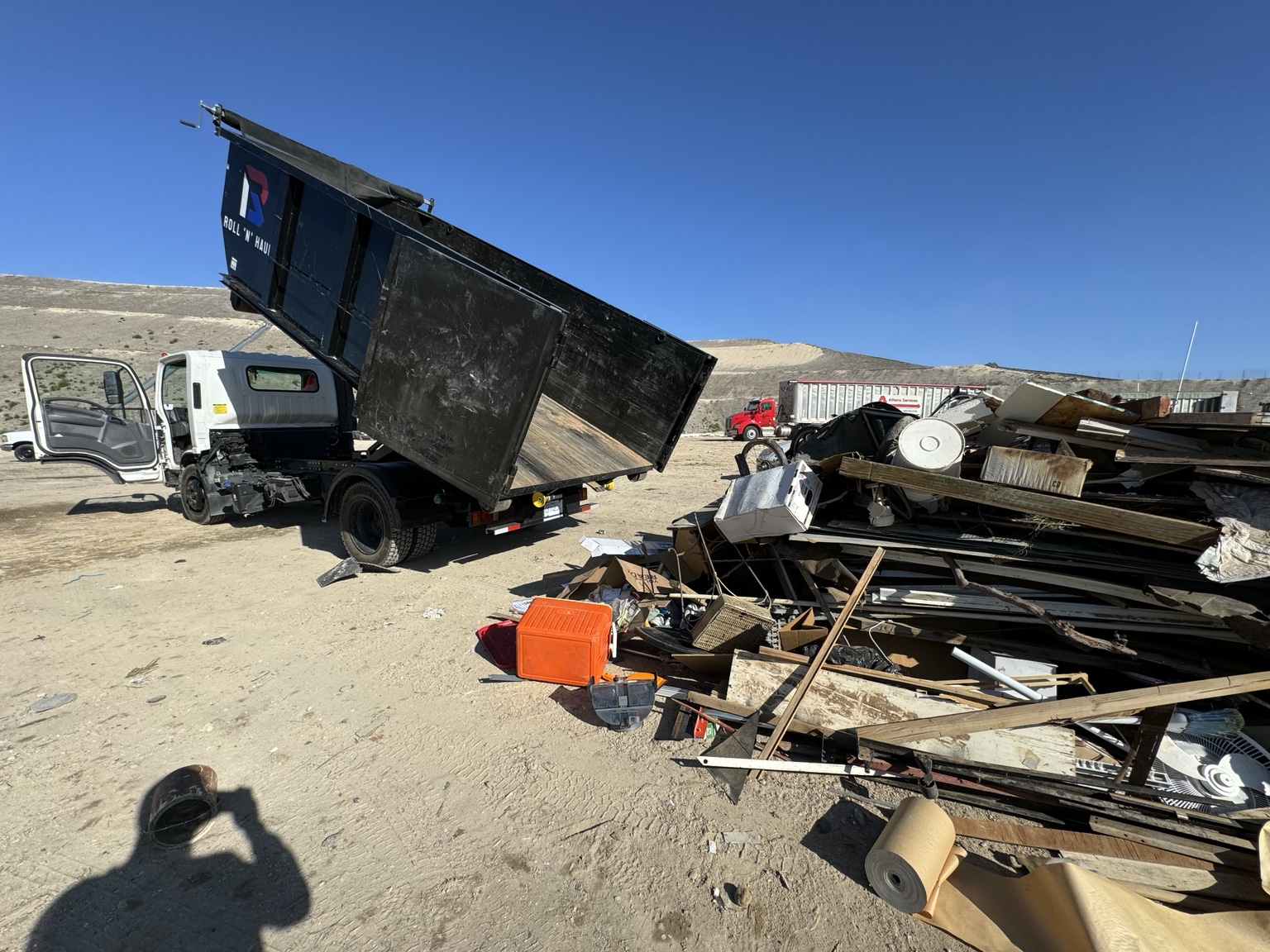 Roll N Haul junk removal job with dump truck